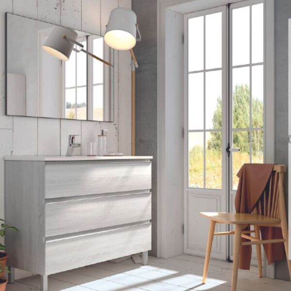 Mueble con patas y tres cajones en acabado madera gris