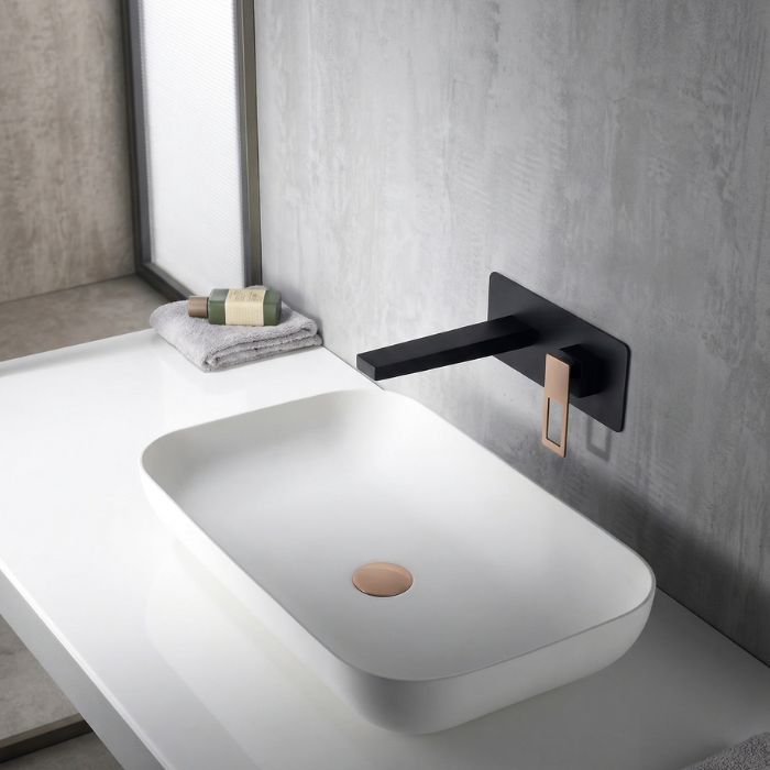 Grifería empotrada de lavabo negro mate con detalles oro rosa