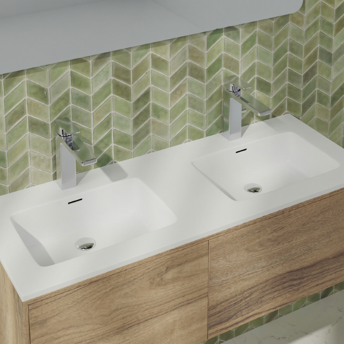 Lavabo doble seno integrado sobre mueble para baño compartido